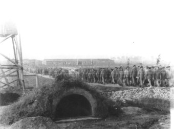 Prisoners marching out of the camp to go to work'© Fritz Bauer Institute (APMO Collection / Auschwitz-Birkenau State Museum)