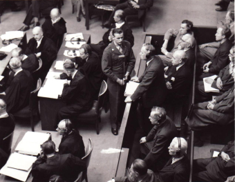 August von Knieriem (standing) pleads “not guilty” on August 14, 1947'© National Archives, Washington, DC